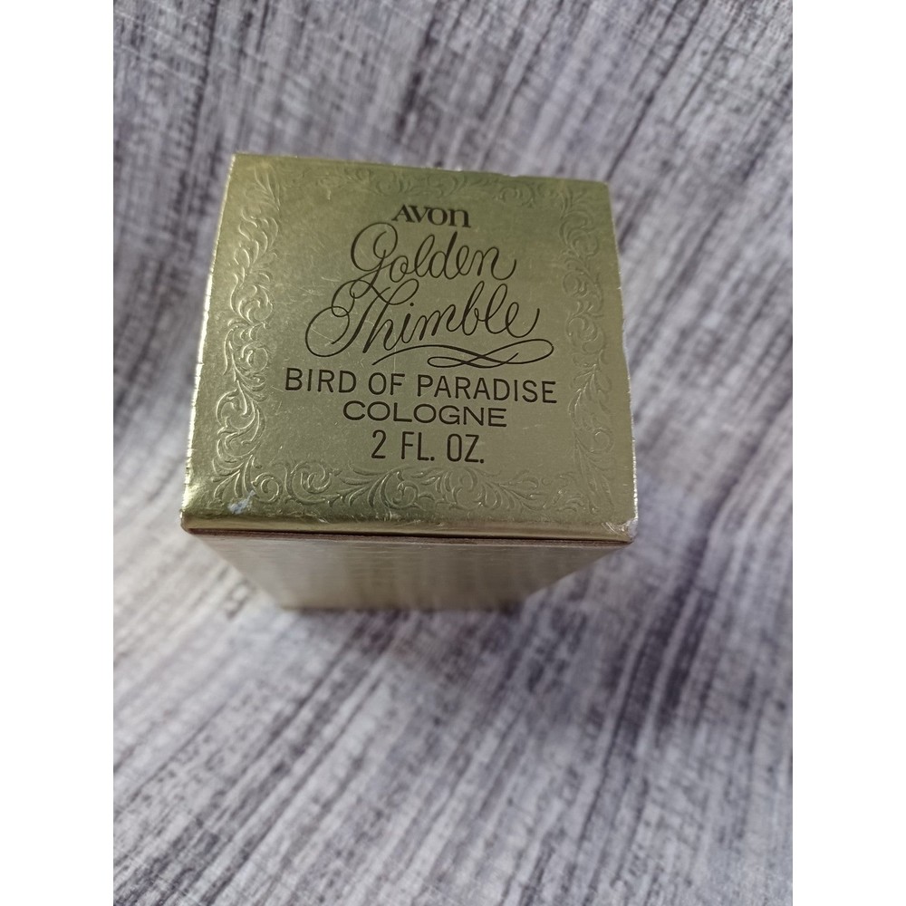 Vintage Avon Golden Thimble Bird of Paradise. 1972-1974. New open box. 2 FL. Oz.